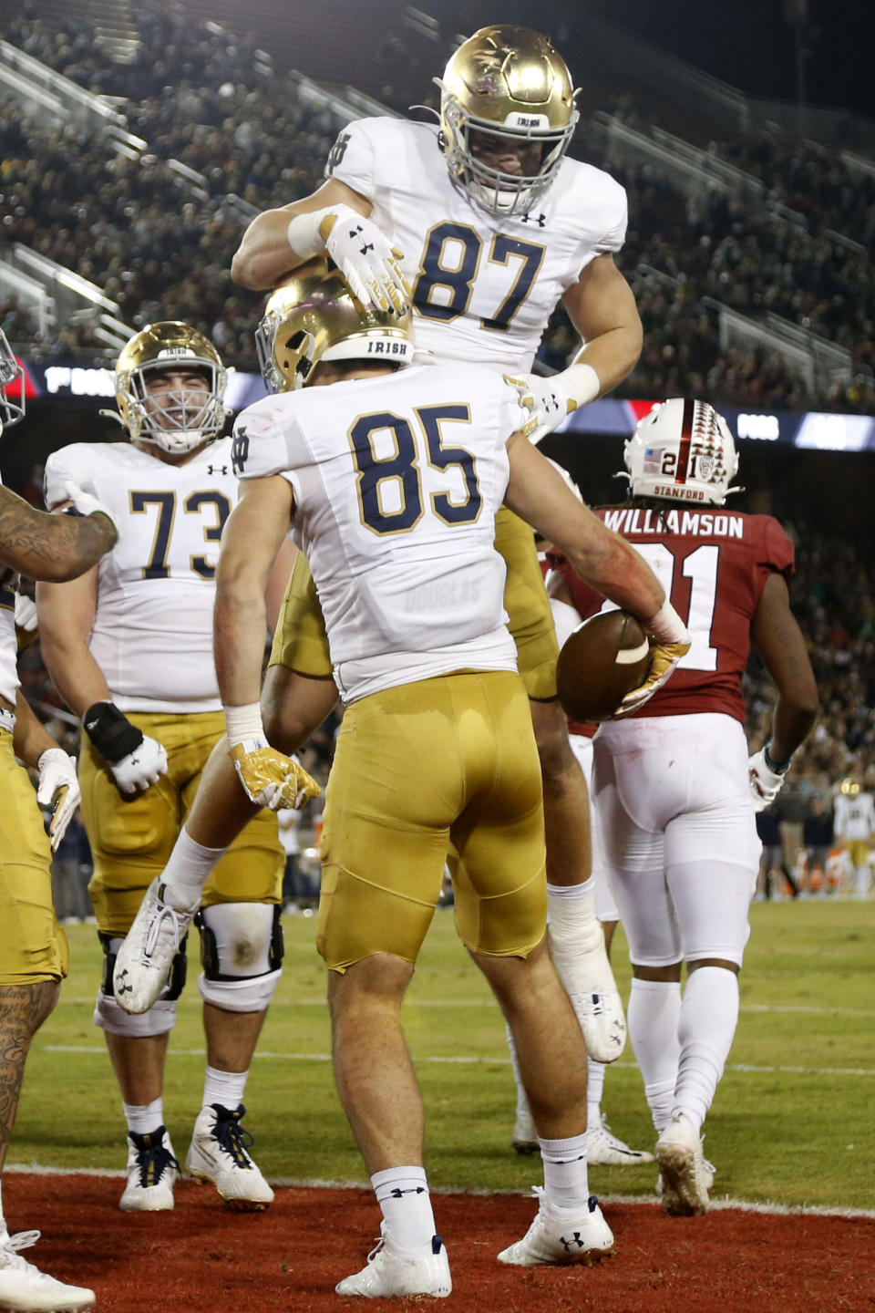 Notre Dame's George Takacs (85) celebrates with Michael Mayer (87) after catching a touchdown pass against Stanford during the first half of an NCAA college football game in Stanford, Calif., Saturday, Nov. 27, 2021. (AP Photo/Jed Jacobsohn)