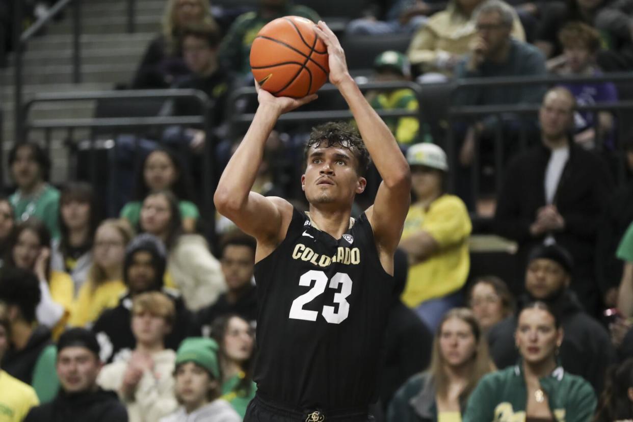 Colorado forward Tristan da Silva (23) shoots against Oregon.