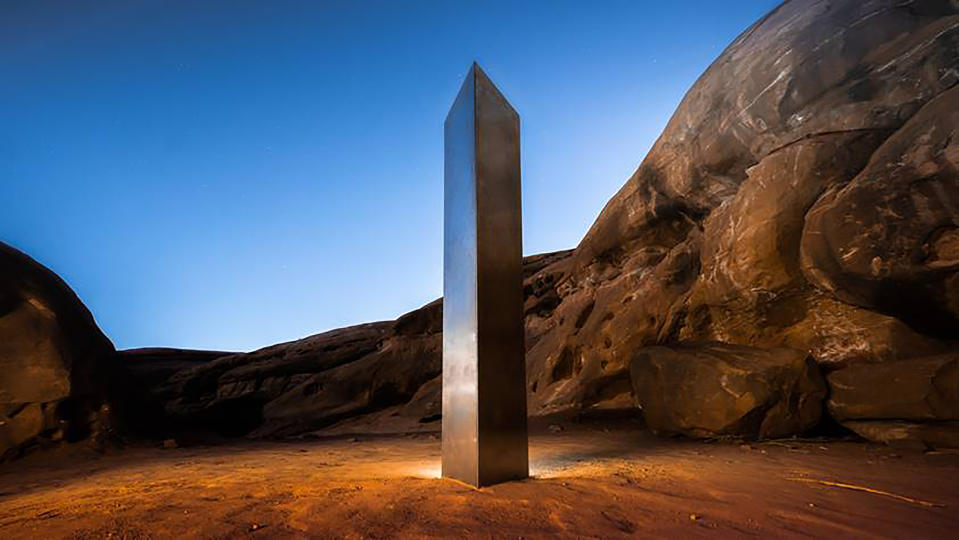 This Nov. 27, 2020 photo by Terrance Siemon shows a monolith that was placed in a red-rock desert in an undisclosed location in San Juan County southeastern Utah. New clues have surfaced in the disappearance of the gleaming monolith in Utah that seemed to melt away as mysteriously as it appeared in the red-rock desert. A Colorado photographer told a TV station in Salt Lake City that he saw four men push over the hollow, stainless steel structure in Utah on Friday night. (Terrance Siemon via AP)