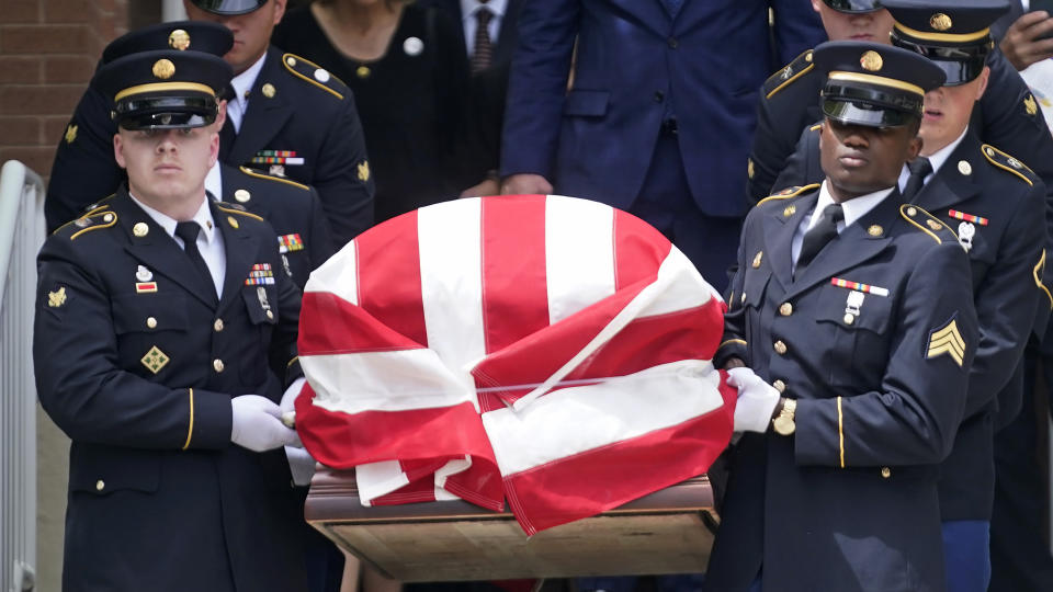 Members of the Utah Army National Guard carry the casket of former Utah Sen. Orrin Hatch during funeral services at The Church of Jesus Christ of Latter-day Saints' Institute of Religion Friday, May 6, 2022, in Salt Lake City. Hatch, the longest-serving Republican senator in history and a fixture in Utah politics for more than four decades, died last month at the age of 88. (AP Photo/Rick Bowmer)