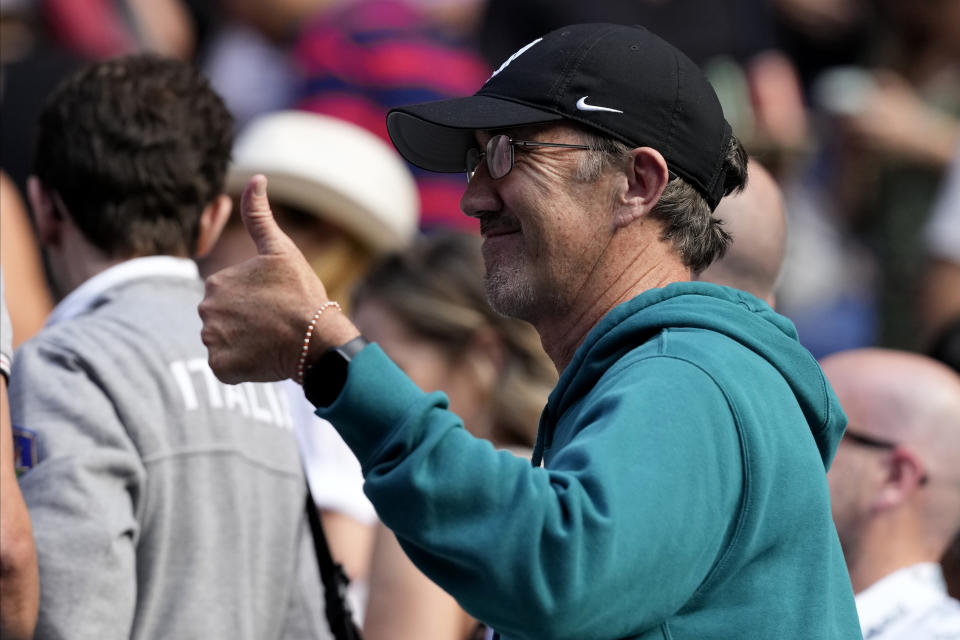 Darrin Cahill, coach of Jannik Sinner of Italy, gestures following his win over Novak Djokovic of Serbia in their semifinal at the Australian Open tennis championships at Melbourne Park, Melbourne, Australia, Friday, Jan. 26, 2024. (AP Photo/Alessandra Tarantino)