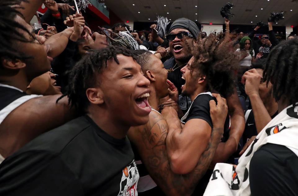 The Buchtel Griffins celebrate with their fans after beating Bishop Ready in a Division II state semifinal, Friday, March 17, 2023, in Dayton.