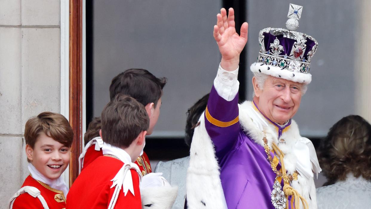 Prince George smiling with King Charles on balcony at coronation