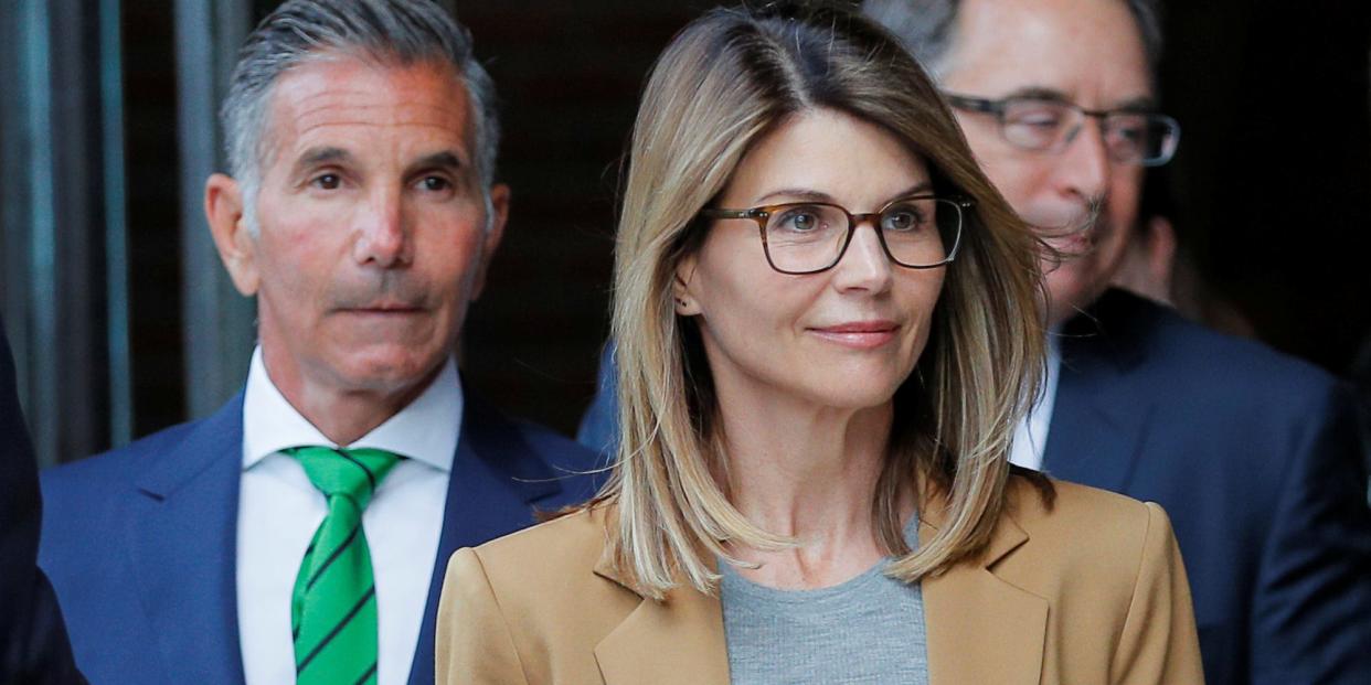 Actor Lori Loughlin, and her husband, fashion designer Mossimo Giannulli, leave the federal courthouse after facing charges in a nationwide college admissions cheating scheme, in Boston, Massachusetts,.JPG