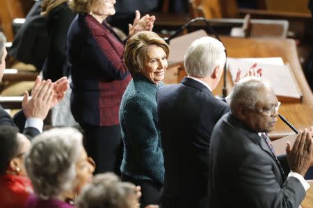 U.S. Representative Nancy Pelosi (D-CA) (C) smiles after the Democratic caucus nominated her during the election for House Speaker on the House floor on the first day of their new session at the U.S. Capitol in Washington January 6, 2015. REUTERS/Jonathan Ernst