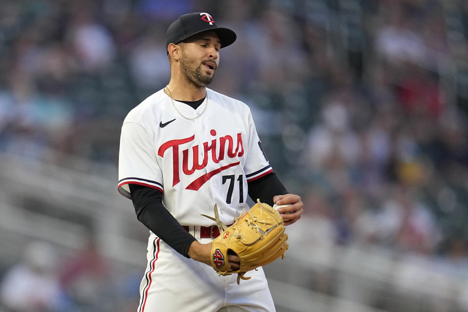 Minnesota Twins relief pitcher Jovani Moran (71) reacts after issuing a walk with the bases loaded to result in a run scored by San Francisco Giants' J.D. Davis during the sixth inning of a baseball game Tuesday, May 23, 2023, in Minneapolis. (AP Photo/Abbie Parr)