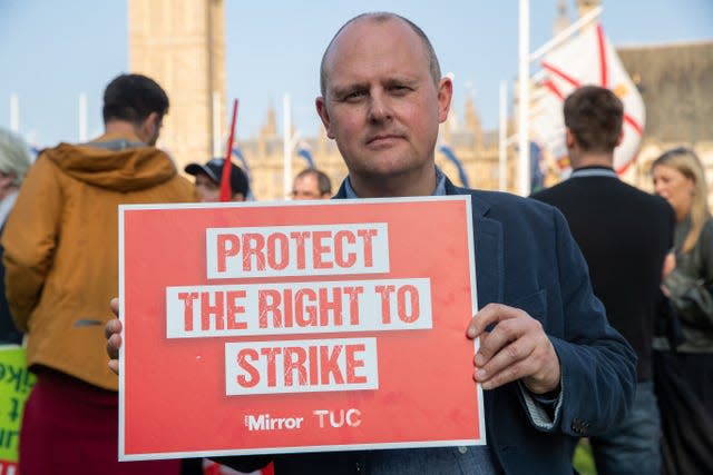 Paul Nowak holding up a sign