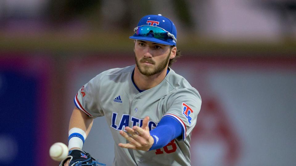 Louisiana Tech first baseman Bryce Wallace (18) throws during an NCAA baseball game against Nicholls on Tuesday, March 1, 2022, in Thibodaux, La. (AP Photo/Matthew Hinton)