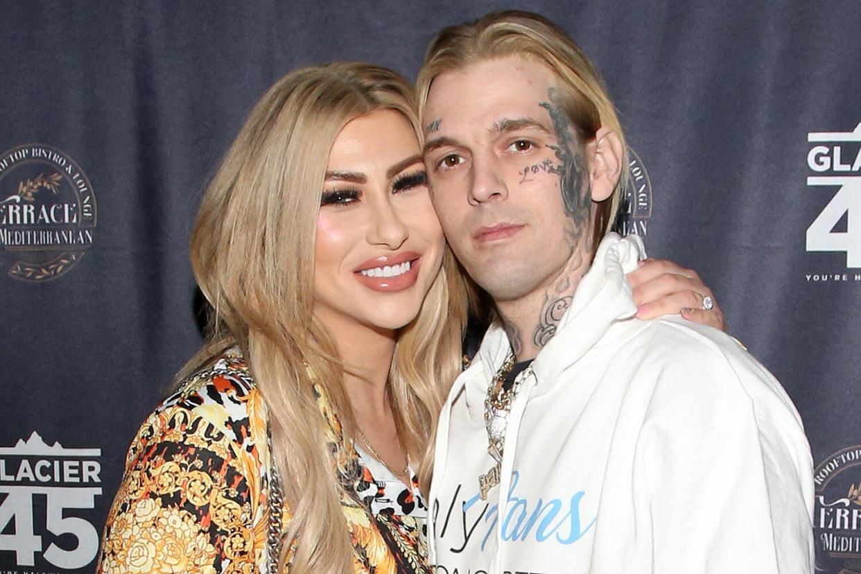 Model Melanie Martin (L) and her fiance, singer and producer Aaron Carter, arrive at the "Kings of Hustler" male revue at Larry Flynt's Hustler Club on February 12, 2022 in Las Vegas, Nevada.