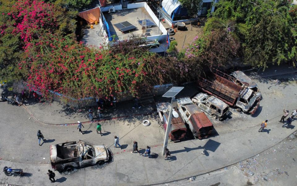 Aerial view of burnt-out vehicles in front of a police station in Port-au-Prince, Haiti, on March 5