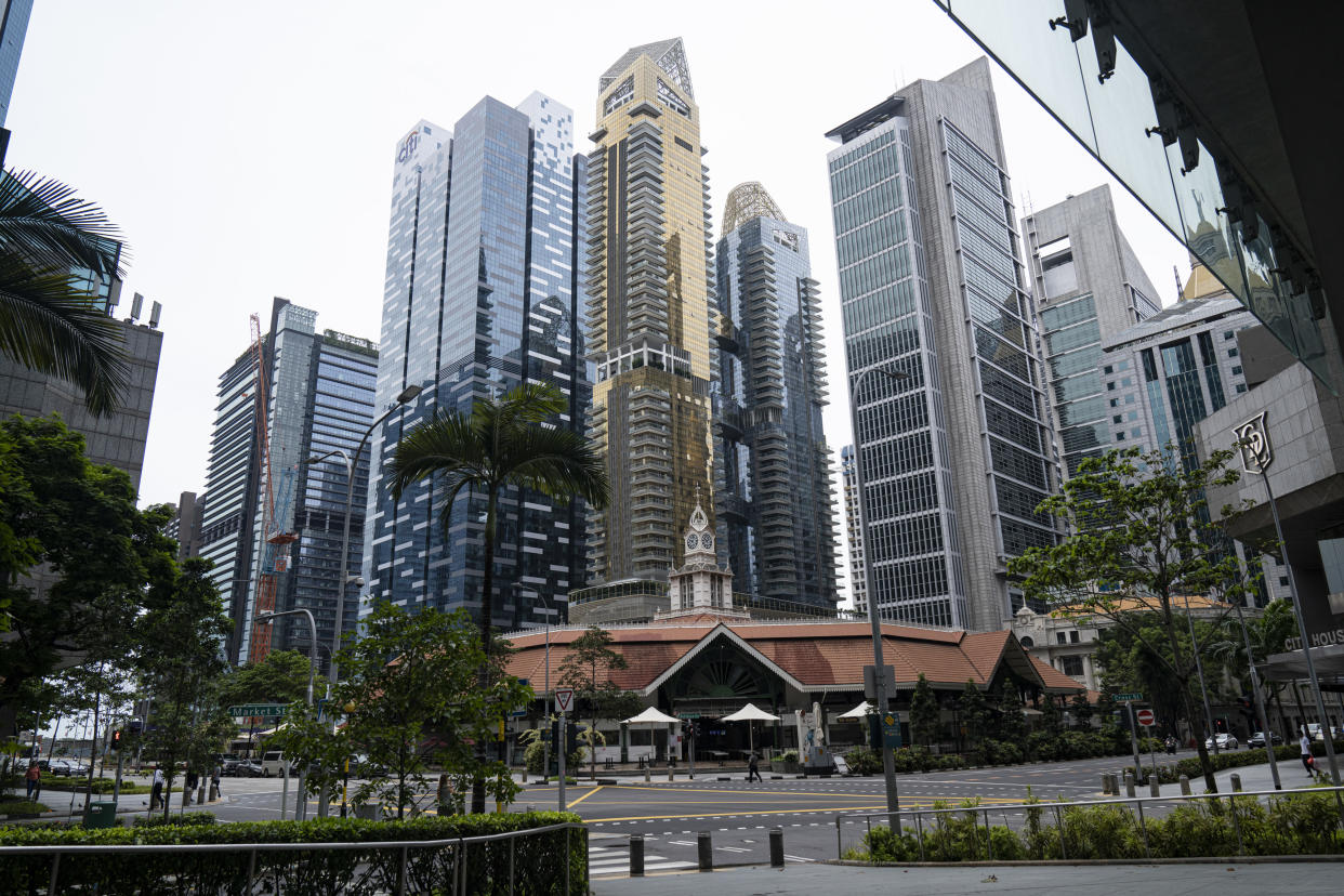 SINGAPORE, SINGAPORE - APRIL 7: General view of an empty road in the central business district on the day a 'circuit breaker' takes effect on April 7, 2020 in Singapore. The Singapore government will close all schools and most workplaces and limit social interactions and movement outside homes for at least a month to stem the spike in local coronavirus (COVID-19) cases. (Photo by Ore Huiying/Getty Images)