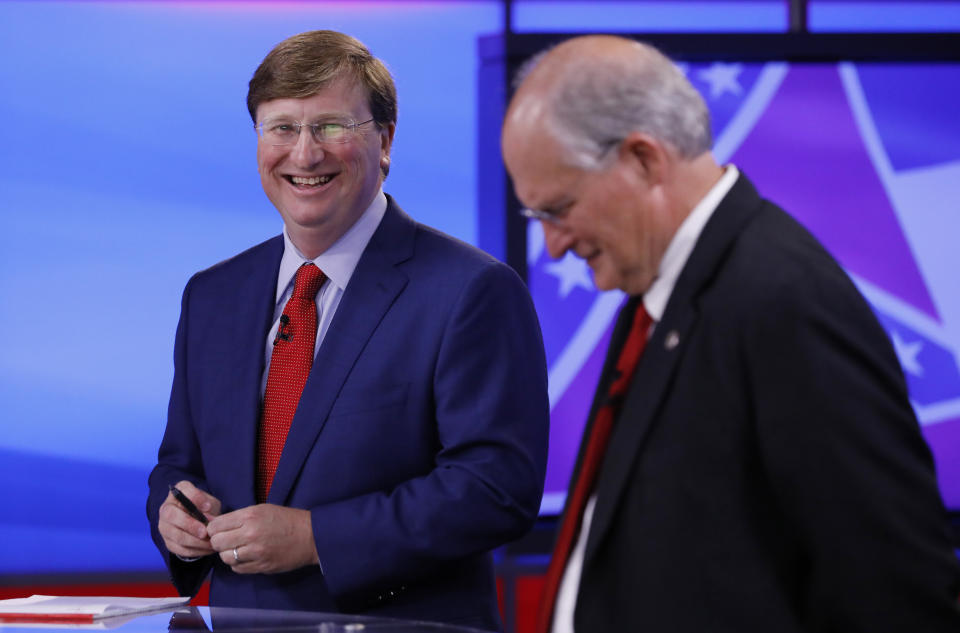 Lt. Gov. Tate Reeves, laughs, prior to a GOP gubernatorial runoff debate against former Mississippi Supreme Court Chief Justice and gubernatorial candidate Bill Waller Jr., right, in Jackson, Miss., Wednesday, Aug. 21, 2019. (AP Photo/Rogelio V. Solis)