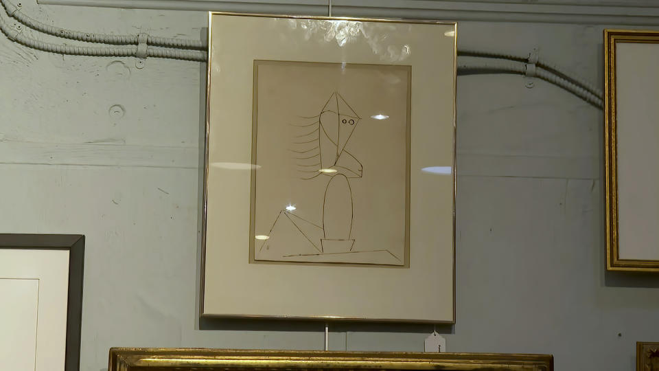 FILE - In this image from video, a Picasso sketch belonging to the late Justice Ruth Bader Ginsburg is seen inside Potomack Company Auctions in Alexandria, Va., Monday, April 11, 2022. An online auction of 150 of items owned by Ginsburg raised $803,650 for Washington National Opera. The opera was one of the late justice’s passions. (AP Photo/Nathan Ellgren, File)