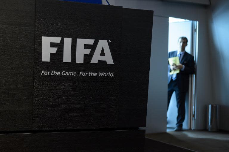 A staff member prepares for a press conference at FIFA HQ
