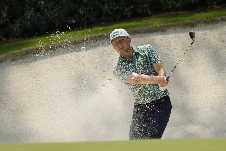 Mackenzie Hughes, of Canada, hits from the bunker on the 13th hole during the first round of the Masters golf tournament at Augusta National Golf Club on Thursday, April 6, 2023, in Augusta, Ga. (AP Photo/David J. Phillip)