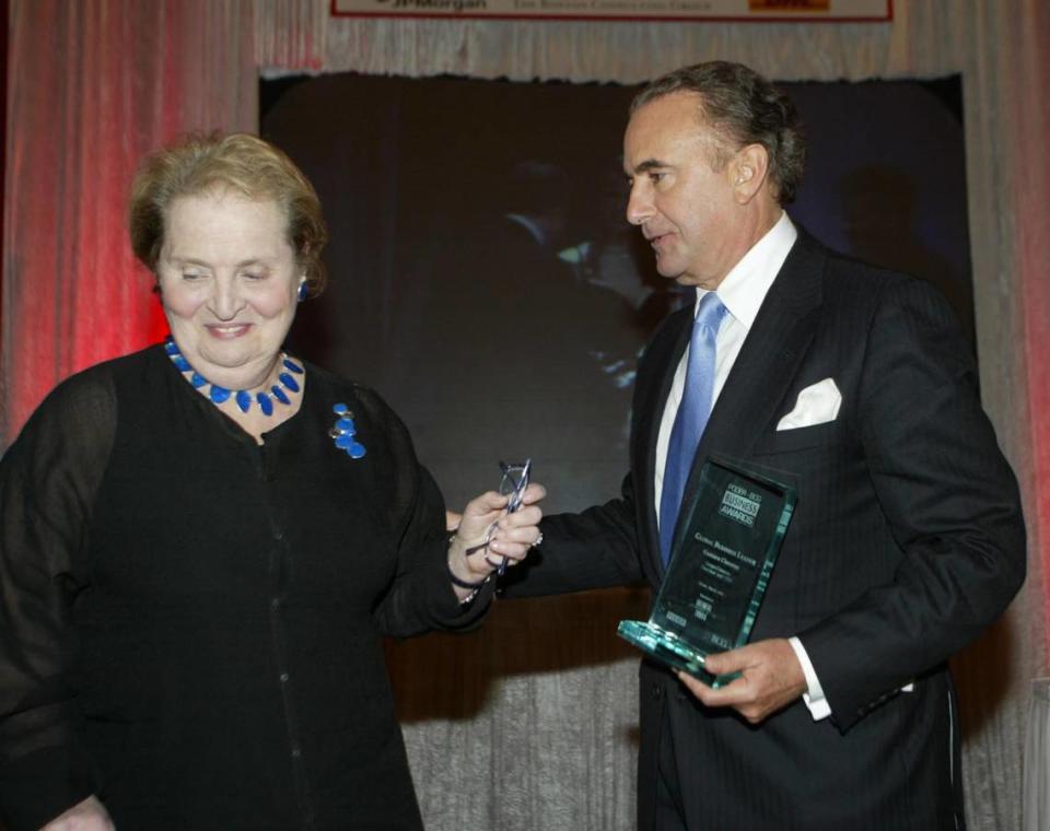 In this file photo from March 3, 2004, Gustavo Cisneros, chairman of Cisneros Group Company, received honors from former Secretary of State of the United States Madeleine Albright at a Poder awards ceremony at the Biltmore Hotel in Coral Gables.