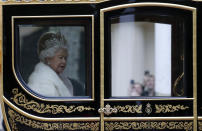 Britain's Queen Elizabeth II travels in a carriage to parliament for the official State Opening of Parliament in London, Monday, Oct. 14, 2019. (AP Photo/Frank Augstein)