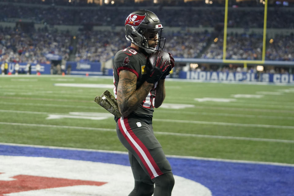 Tampa Bay Buccaneers wide receiver Mike Evans (13) scores a touchdown during the first half of an NFL football game against the Indianapolis Colts Sunday, Nov. 26, 2023, in Indianapolis. (AP Photo/Darron Cummings)