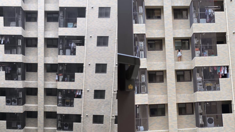 網友發文表示社區大樓外，一名女童驚險站在外牆凸起處。（翻攝自爆怨公社）
