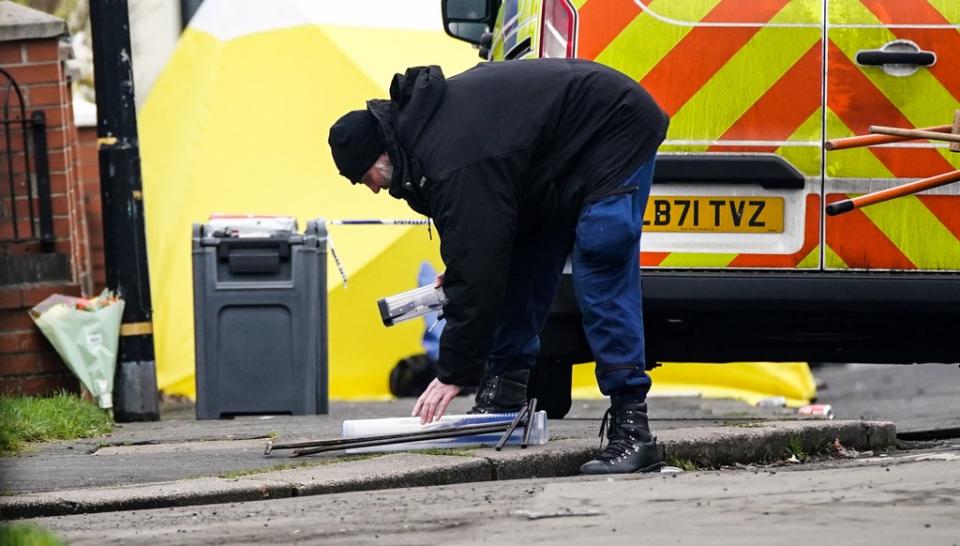 Police at the scene (Peter Byrne/PA) (PA Wire)