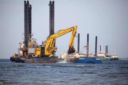 FILE PHOTO: Floating excavators prepare an underwater trench for the North Stream 2 pipeline close to Lubmin, Germany, May 15, 2018. REUTERS/Axel Schmidt/File Photo