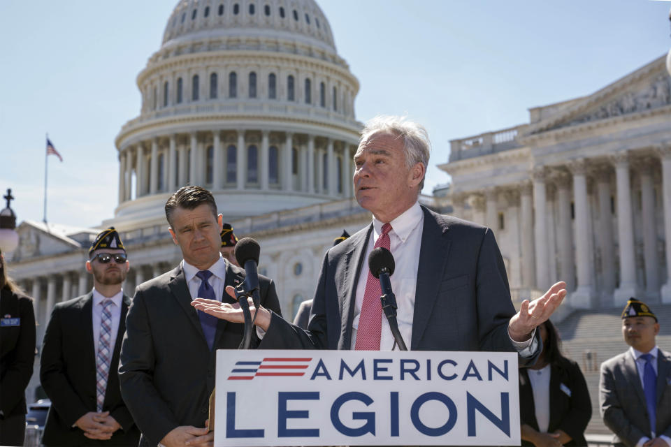 Sen. Tim Kaine, D-Va., center, and Sen. Todd Young, R-Ind., center left, are joined by representatives of the American Legion as they speak to reporters about ending the authorization for use of military force enacted after the Sept. 11, 2001 terrorist attacks, at the Capitol in Washington, Thursday, March 16, 2023. Senators voted 68-27 Thursday to move forward with a bill to repeal the 2002 measure that authorized the March 2003 invasion of Iraq and a 1991 measure that sanctioned the U.S.-led Gulf War to expel Iraqi leader Saddam Hussein's forces from Kuwait. (AP Photo/J. Scott Applewhite)