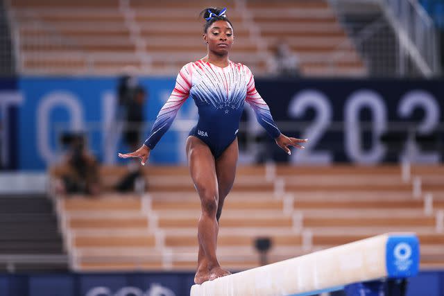 <p>Elsa/Getty</p> Simone Biles of Team United States competes in the Women's Balance Beam Final on day eleven of the Tokyo 2020 Olympic Games.