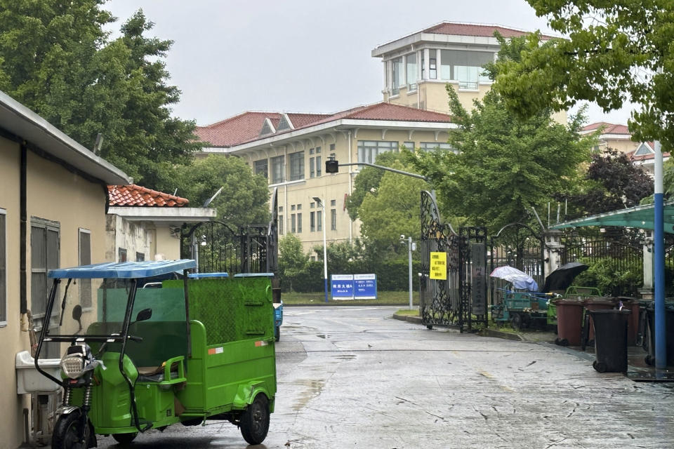 Buildings in the Shanghai Public Health Clinical Center stand near the entrance of the compound in Shanghai, China Tuesday, April 30, 2024. Zhang Yongzhen, the first scientist to publish a sequence of the COVID-19 virus, staged a sit-in protest after authorities locked him out of his lab at the center. (AP Photo/Dake Kang)