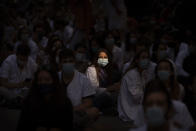 Medical residents sit in the middle of an avenue as they take part in a protest against their working conditions during a strike in Barcelona, Spain, Monday, Sept. 28, 2020. (AP Photo/Emilio Morenatti)