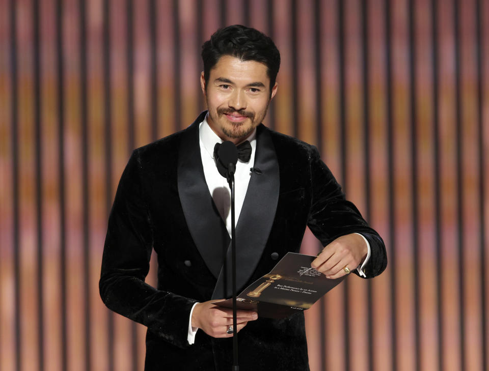 This image released by NBC shows presenter Henry Golding during the 80th Annual Golden Globe Awards at the Beverly Hilton Hotel on Tuesday, Jan. 10, 2023, in Beverly Hills, Calif. (Rich Polk/NBC via AP)