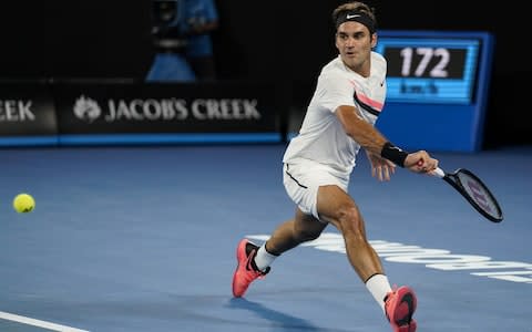 Roger Federer of Switzerland plays a backhand in his second round match against Jan-Lennard Struff of Germany on day four of the 2018 Australian Open at Melbourne Park on January 18, 2018 in Melbourne, Australia - Credit: Getty Images