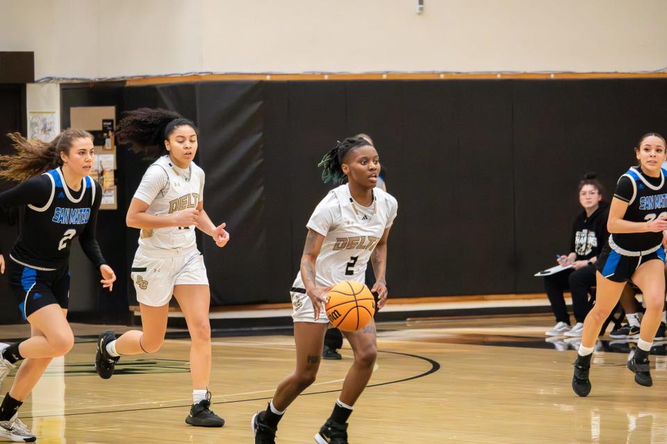 Senia Moore (center) takes off down the court returning the ball to the Mustangs’ basket during the playoff game at San Joaquin Delta College in Stockton, CA on Mar. 2, 2024.