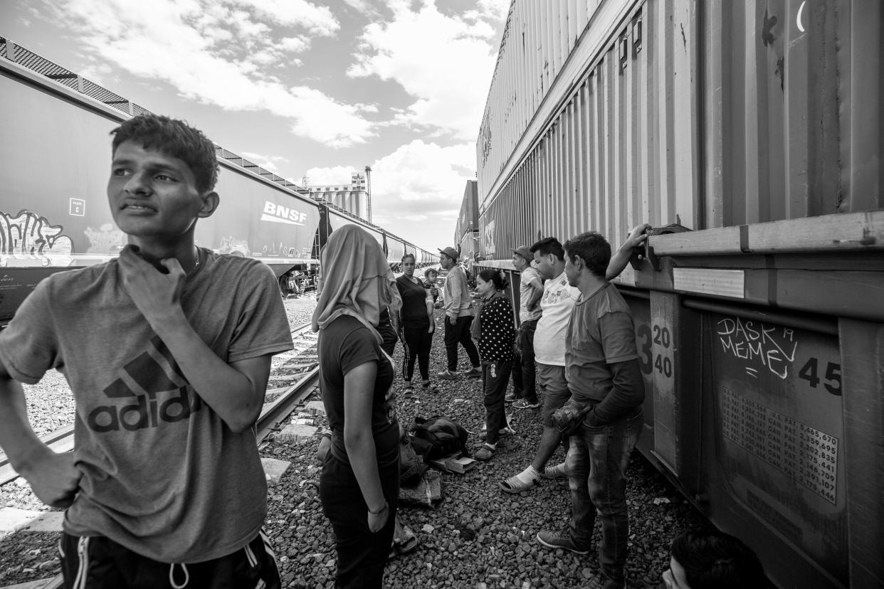 Migrants wait for a train to leave for Ciudad Juárez at a rail yard in Chihuahua City, Mexico on Sept. 23, 2023.