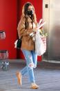 <p>Lily Collins totes her festive finds from a Target in West Hollywood on Saturday.</p>