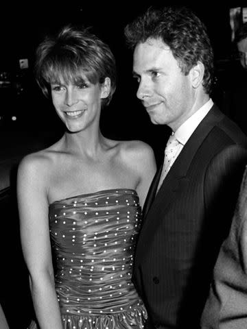 <p>Ron Galella/Ron Galella Collection/Getty</p> Jamie Lee Curtis and Christopher Guest attend "Perfect" premiere in May 1985 in New York City.