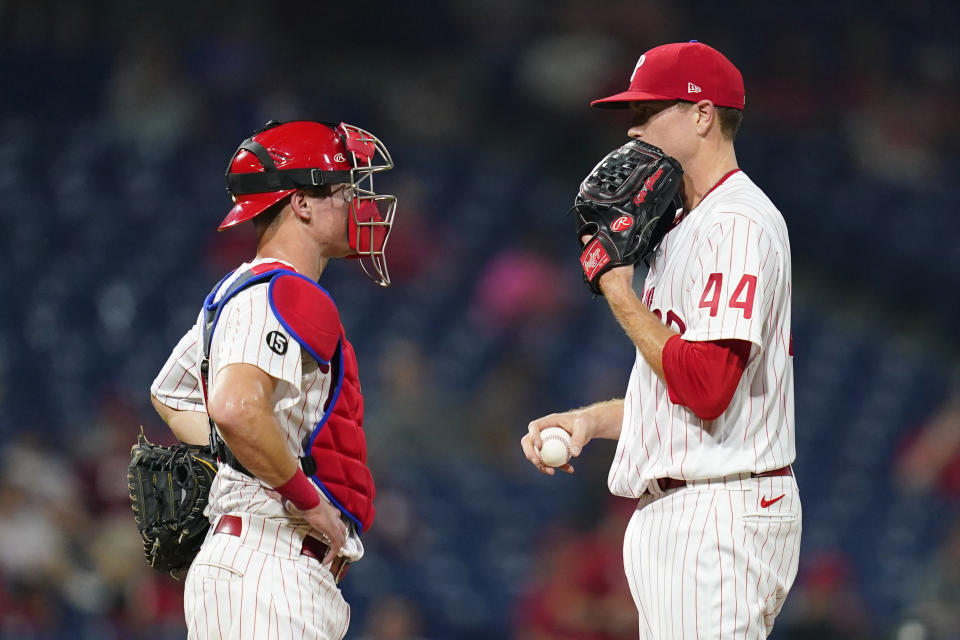 Philadelphia Phillies pitcher Kyle Gibson, right, and catcher Andrew Knapp talk during the fifth inning of a baseball game against the Chicago Cubs, Tuesday, Sept. 14, 2021, in Philadelphia. (AP Photo/Matt Slocum)