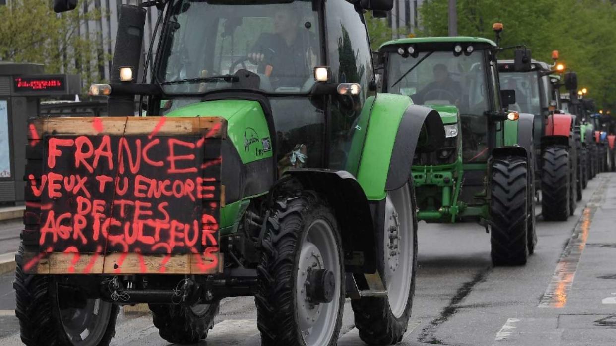 Farmers called by the National Federation of Agricultural Holders' Unions ('Federation nationale des syndicats d'exploitants agricoles' - FDSEA) demonstrate in their tractors with a banner reading 