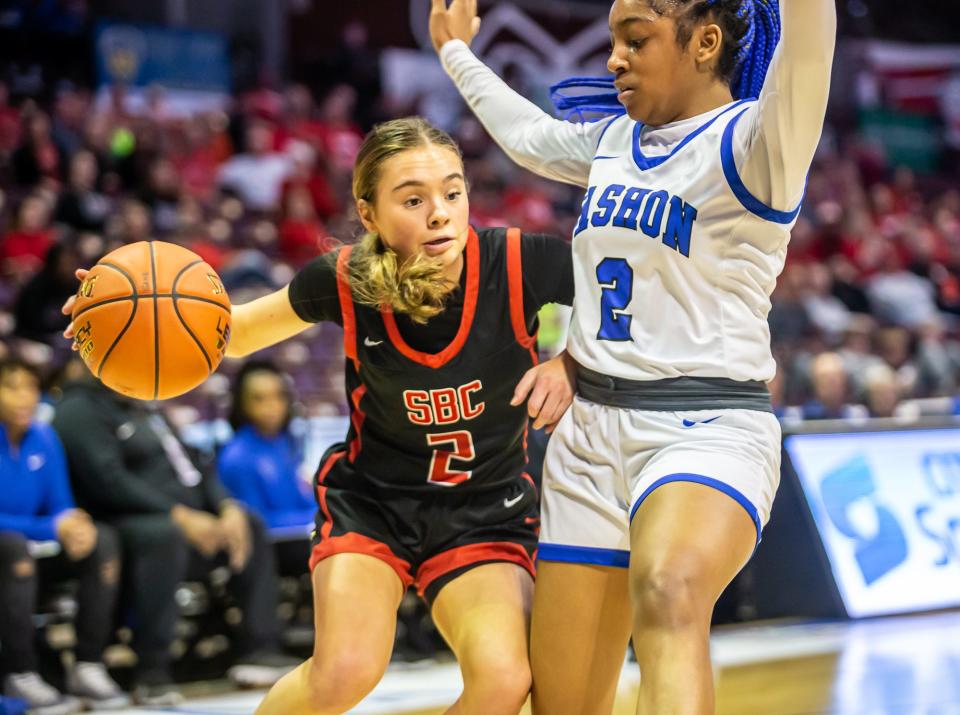 Southern Boone's Kyra Massie drives the lane while being defended by Vashon's Chantrel Clayton during a Class 4 girls semifinal basketball game on Thursday, March 16, 2023, at Missouri State University in Springfield, Mo.