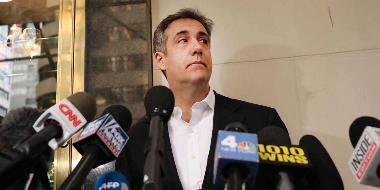 Michael Cohen stands with microphones in front of his Manhattan apartment on May 06, 2019 in New York City.