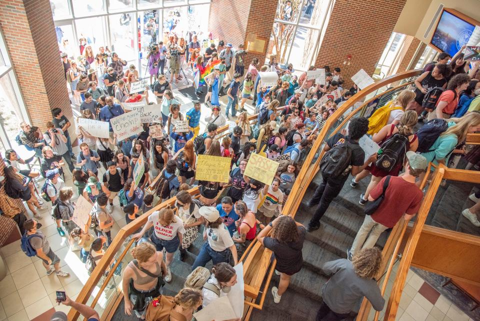 Protestors enter Emerson Alumni Hall during Sen. Ben Sasse’s open forum discussion in Gainesville, Fla., on Monday, Oct. 10, 2022. (Lawren Simmons/Special to the Sun)