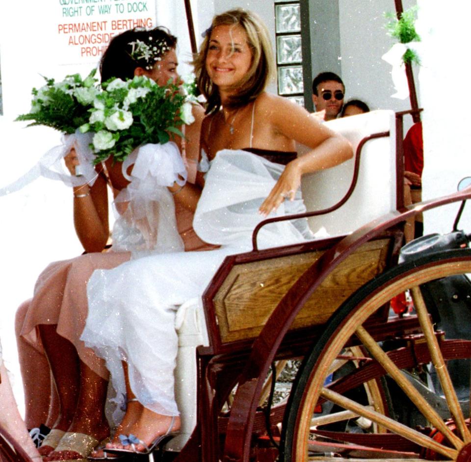 Arriving for her wedding to Jamie Redknapp in 1998 - Wenn