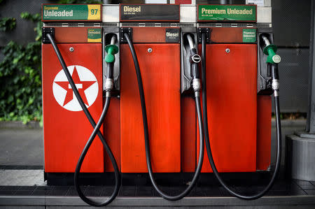 Fuel pumps are seen at a Texaco petrol station in London, Britain, July 26, 2017. REUTERS/Hannah McKay