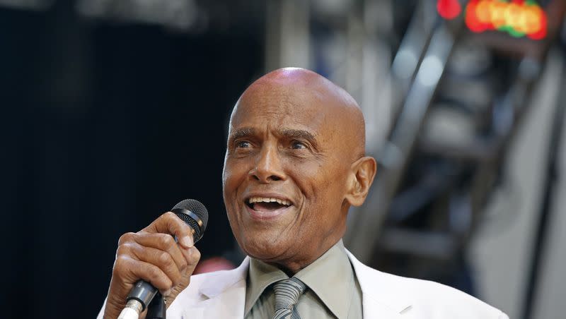 Singer and activist Harry Belafonte speaks during a memorial tribute concert for folk icon and civil rights activist Pete Seeger in New York on July 20, 2014. Belafonte died Tuesday of congestive heart failure at his New York home. He was 96.