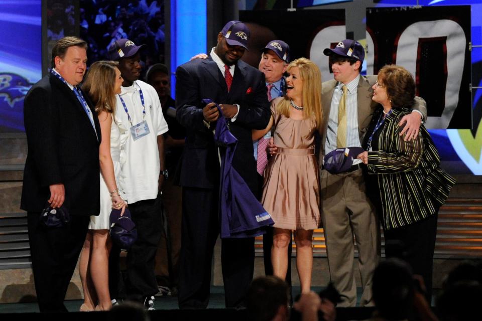 Michael Oher with members of the Tuohy family after being selected by the Baltimore Ravens during the 2009 NFL Draft.