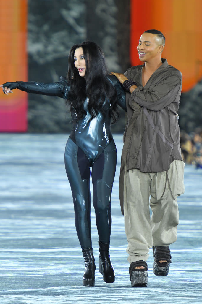 Cher and designer Olivier Rousteing walk the runway during the Balmain Womenswear Spring/Summer 2023 show in Paris. (Getty Images)