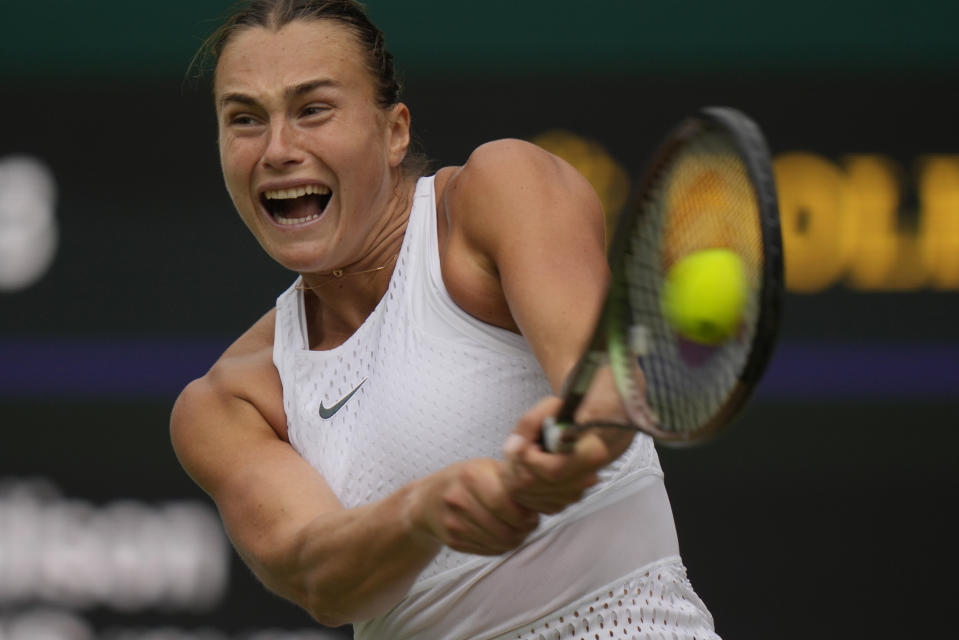 Aryna Sabalenka of Belarus in action against Madison Keys of the US during the women's singles match on day ten of the Wimbledon tennis championships in London, Wednesday, July 12, 2023. (AP Photo/Alastair Grant)