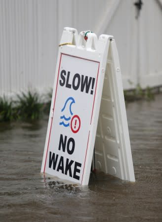 A sign is posted along a flooded street during Hurricane Dorian in Charleston