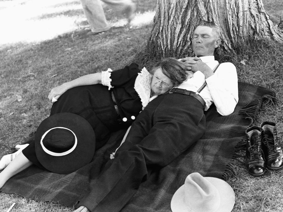 A couple takes a nap on the ground following a July 4 parade in Oregon in 1941.