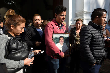 Relatives and friends of slain journalist Ricardo Monlui leave a church after his funeral mass in Cordoba, in the Mexican state of Veracruz, Mexico March 20, 2017. REUTERS/Yahir Ceballos