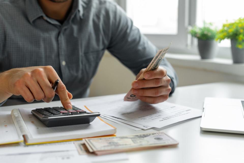 man using calculator